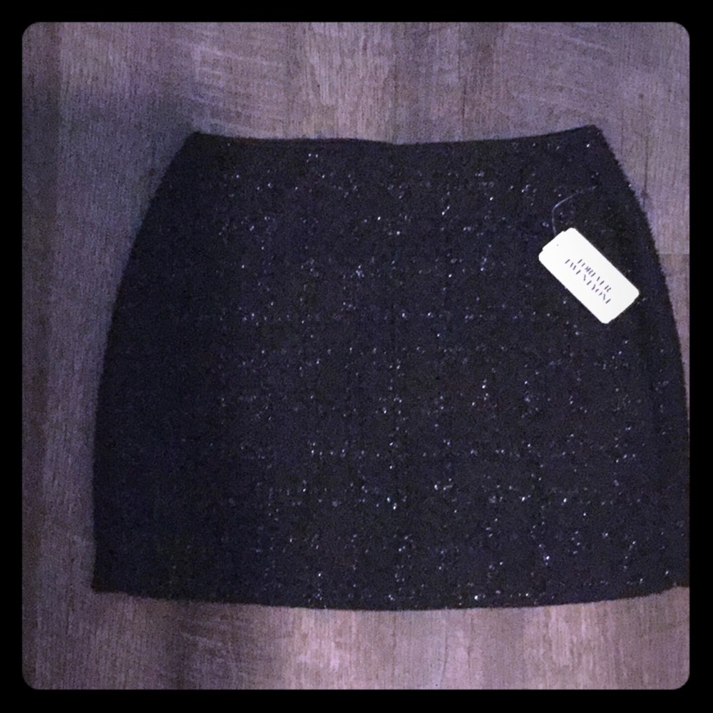 New glittery black mini skirt
